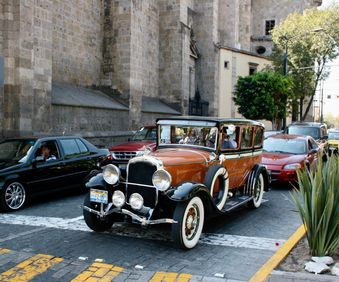 A vintage car alongside modern vehicles on a city street — illustrating that not all cars (or annuities) are the same.