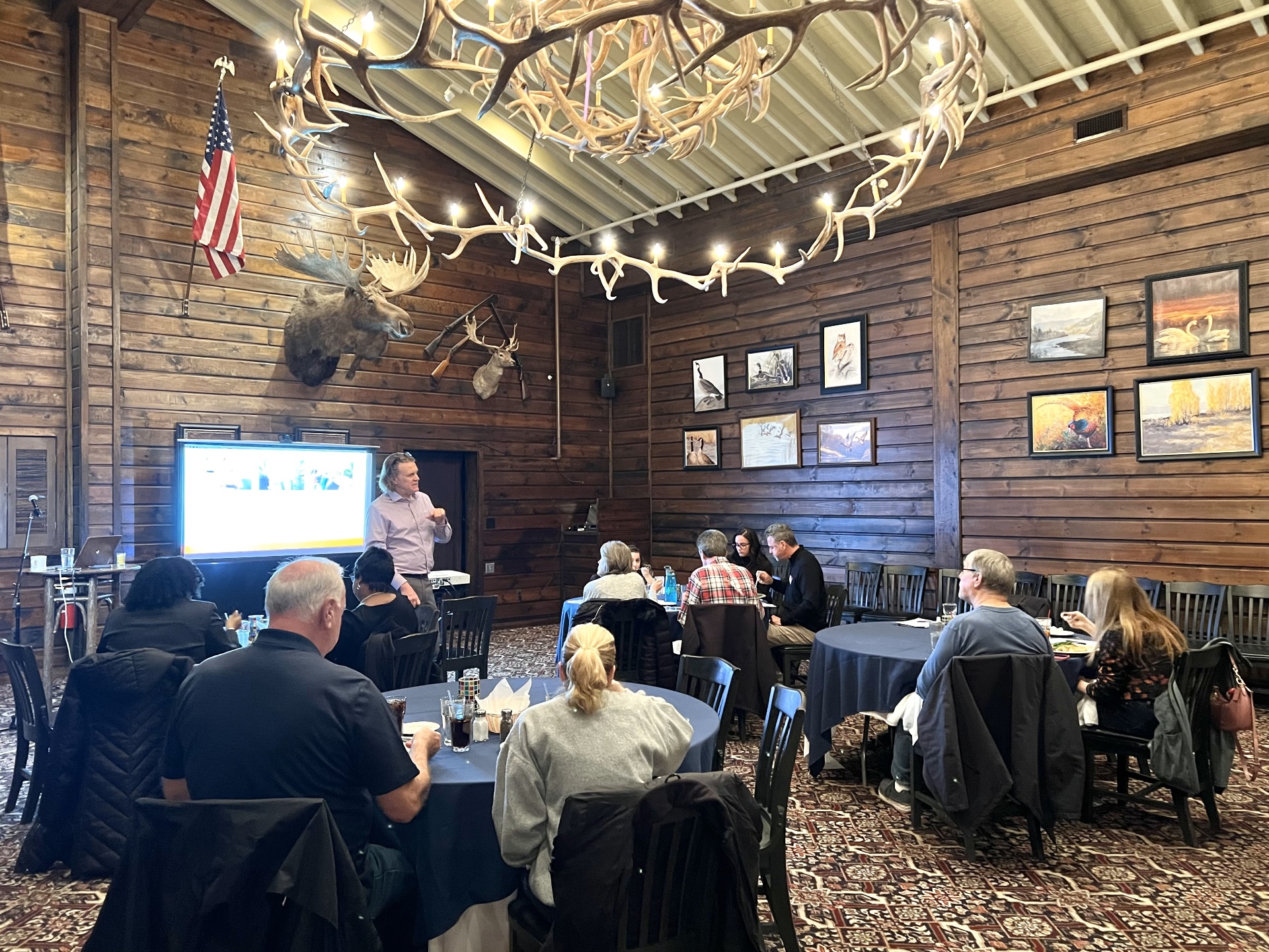 Attendees at a wealth-building dinner seminar at Camp T lodge