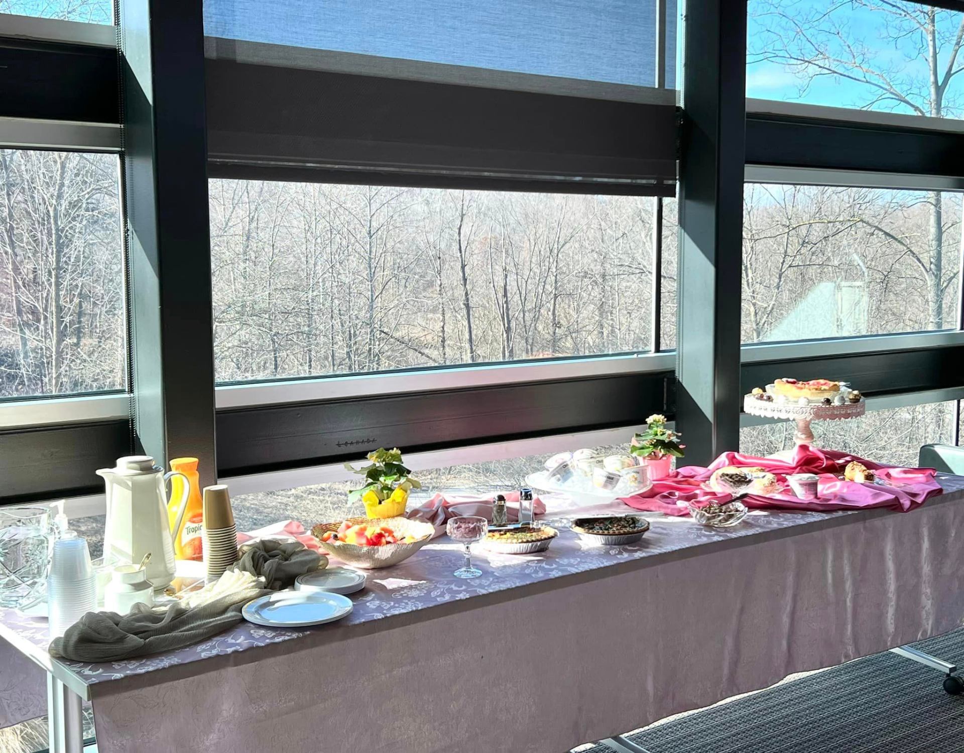 Refreshment table set up for guests at a V8 Wealth Management event